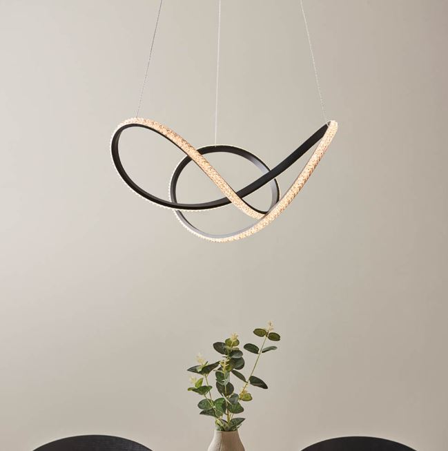 Textured black pendant with clear faceted detail